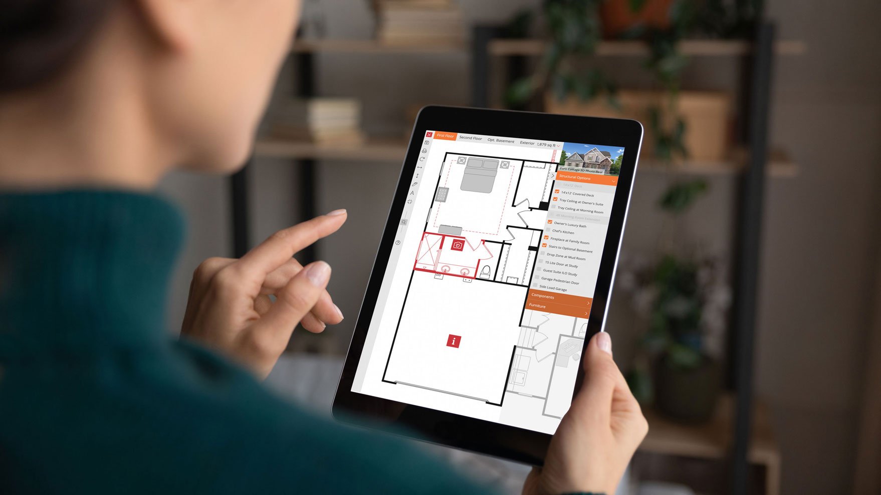 Interactive Floor Plans - woman holding a tablet with an interactive floor plan