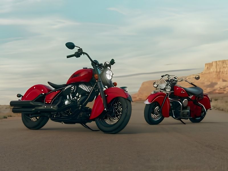 Two red Indian Motorcycles in the middle of the desert.