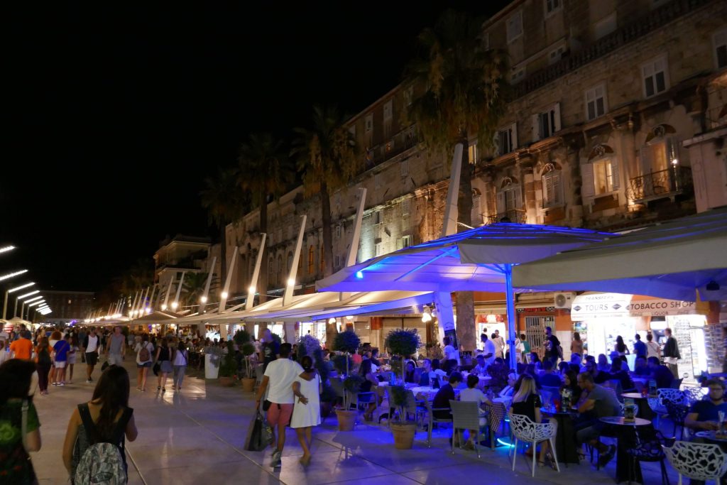 Gathering of people sitting under canopies in Spit Croatia.